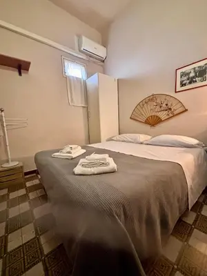 Letto o letti in una camera di Stanza 30 euro per 2 ore Acireale
