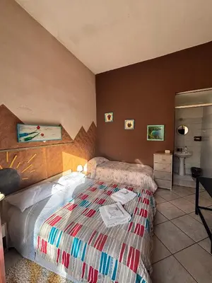 Letto o letti in una camera di Stanza 30 euro per 2 ore Acireale