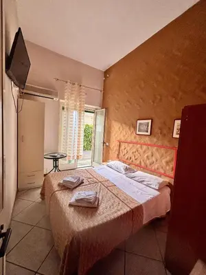 Letto o letti in una camera di Stanza 30 euro per 2 ore Acireale
