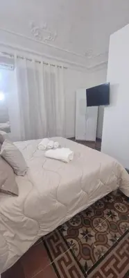 Letto o letti in una camera di Stesicoro house