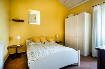 Letto o letti in una camera di Villa Eremo Sant'Emilia
