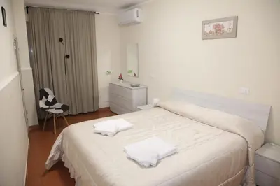 Letto o letti in una camera di La Casetta Per Te