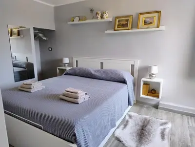 Letto o letti in una camera di Pomelia