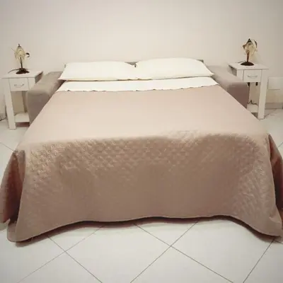 Letto o letti in una camera di Fior dell'Etna