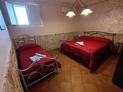 Letto o letti in una camera di Abbentu