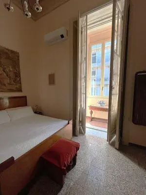 Letto o letti in una camera di Palazzo Vitrano Tourist Apartment 1