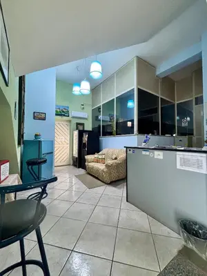 Area soggiorno di Guest house in Acireale