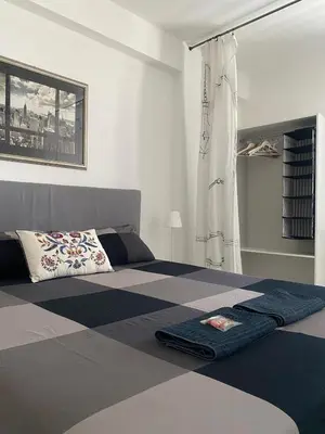Letto o letti in una camera di ADiNHOME ACICASTELLO