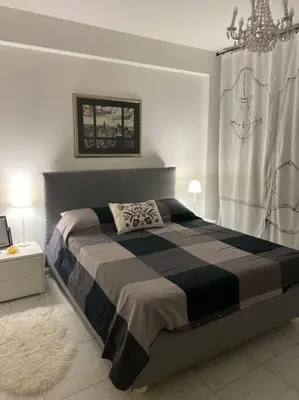 Letto o letti in una camera di ADiNHOME ACICASTELLO