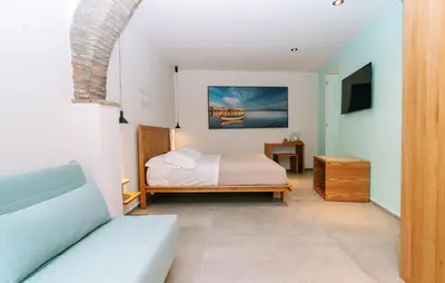 TV o dispositivi per l'intrattenimento presso Etna Cottage Charming Rooms