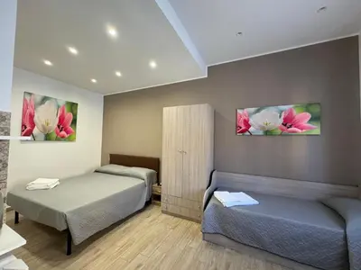 Letto o letti in una camera di Casabella