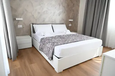Letto o letti in una camera di Perla Marina 2 Acitrezza