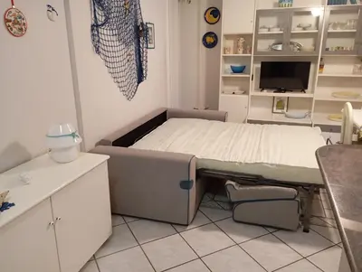 Letto o letti in una camera di ETNA e MARE