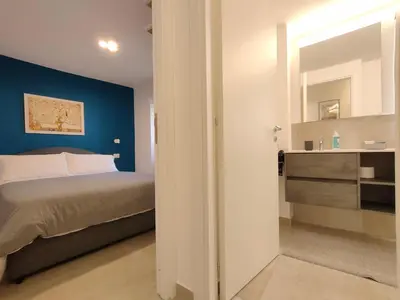 Letto o letti in una camera di Tophouse Catania Centro - Blue Apt