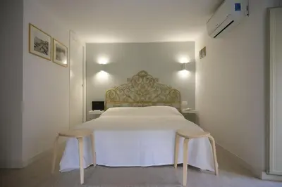 Letto o letti in una camera di Casa Vacanze Marta Aci Trezza