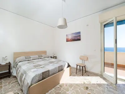Letto o letti in una camera di Casa Nettuno