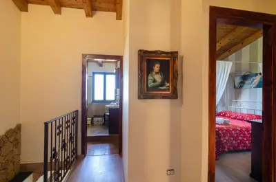 Letto o letti in una camera di La Vecchia Torre - Villa panoramica in Collina