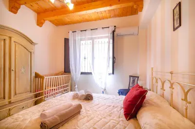 Letto o letti in una camera di La Vecchia Torre - Villa panoramica in Collina