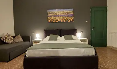 Letto o letti in una camera di Casa Italia