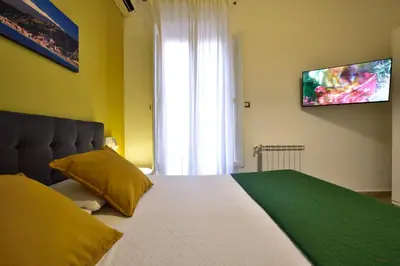 Letto o letti in una camera di Casa Italia