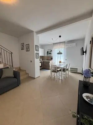 Area soggiorno di Viola's Charming House