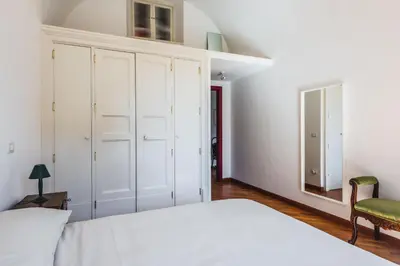 Letto o letti in una camera di Classic Apartment La Maddalena by Wonderful Italy