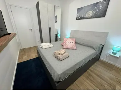Letto o letti in una camera di Casa Belfiore Etna-apartments
