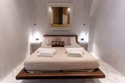 Letto o letti in una camera di Suite al centro storico