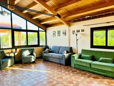 Area soggiorno di Chalet Con Piscina