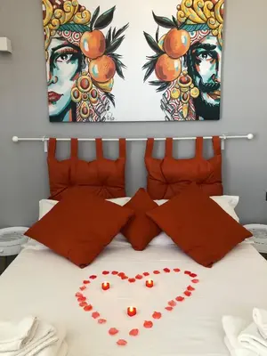 Letto o letti in una camera di VOLCANO'S SUITE - AGRUMI - The First Eco - Chic Suites in Sicily