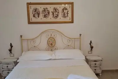 Letto o letti in una camera di Casa vacanze Vico Minaudo