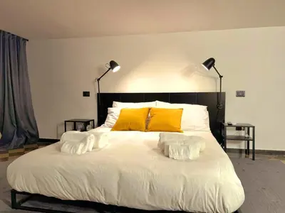 Letto o letti in una camera di MacrHome Catania Centro
