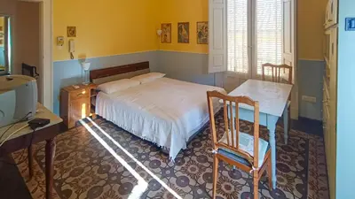 Letto o letti in una camera di Casa Rossi