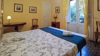Letto o letti in una camera di Casa Rossi