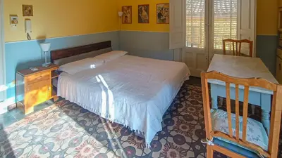 Letto o letti in una camera di Casa Rossi