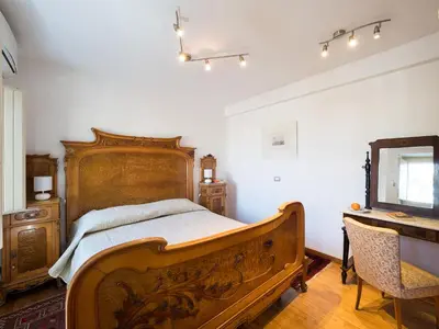 Letto o letti in una camera di Terrazza Reale