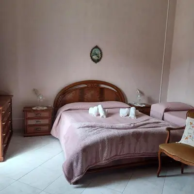 Letto o letti in una camera di Casa vacanza 'A casa dei Nonni 1'