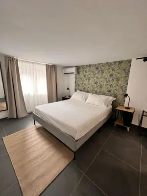 Letto o letti in una camera di Andronico House