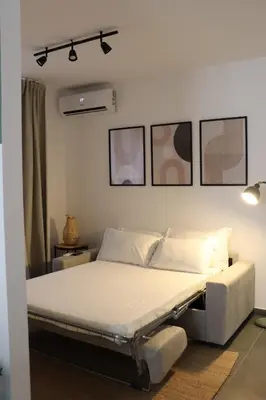 Letto o letti in una camera di Andronico House