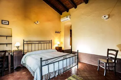 Letto o letti in una camera di Casale Acqua e Fuoco