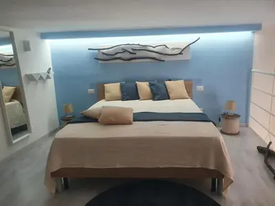 Letto o letti in una camera di La Vela