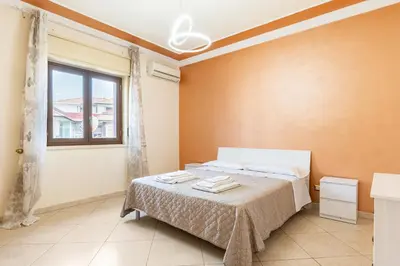 Letto o letti in una camera di GuestHost - Apartment with Terrace in Aci Catena