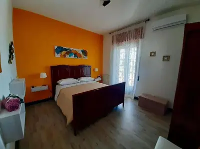 Letto o letti in una camera di LAPILLI Holidays