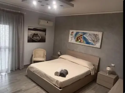 Letto o letti in una camera di Nancy Home Catania
