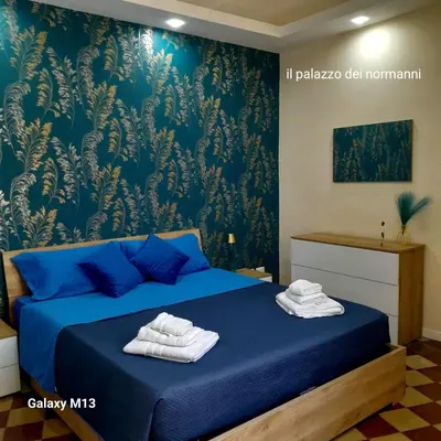 Letto o letti in una camera di Il palazzo Dei Normanni