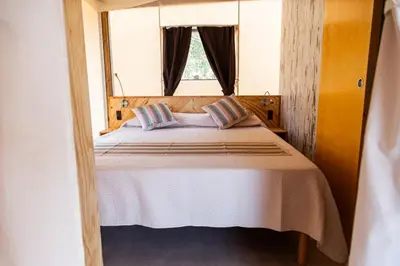 Letto o letti in una camera di Koru Etna Glamping - lodge con vasca idromassaggio privata