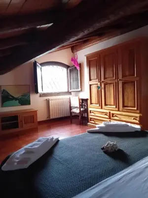 Letto o letti in una camera di Casa Roverelle