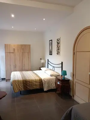 Letto o letti in una camera di B&B Villa Lidia