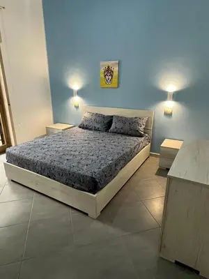 Letto o letti in una camera di La Rosa dello Jonio
