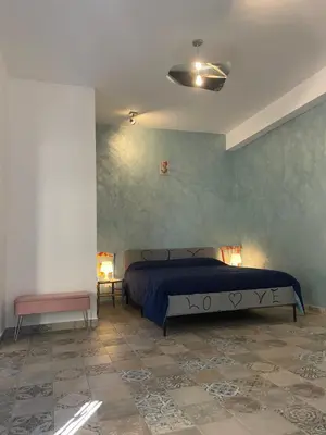 Letto o letti in una camera di Leopardi Holiday Home a due passi dal mare